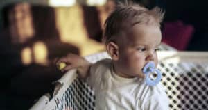 Infant boy in crib