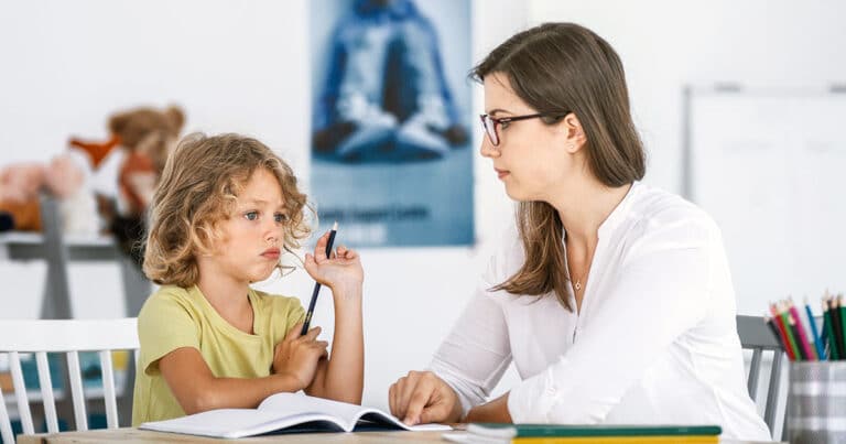 Woman and girl doing a coloring exercise